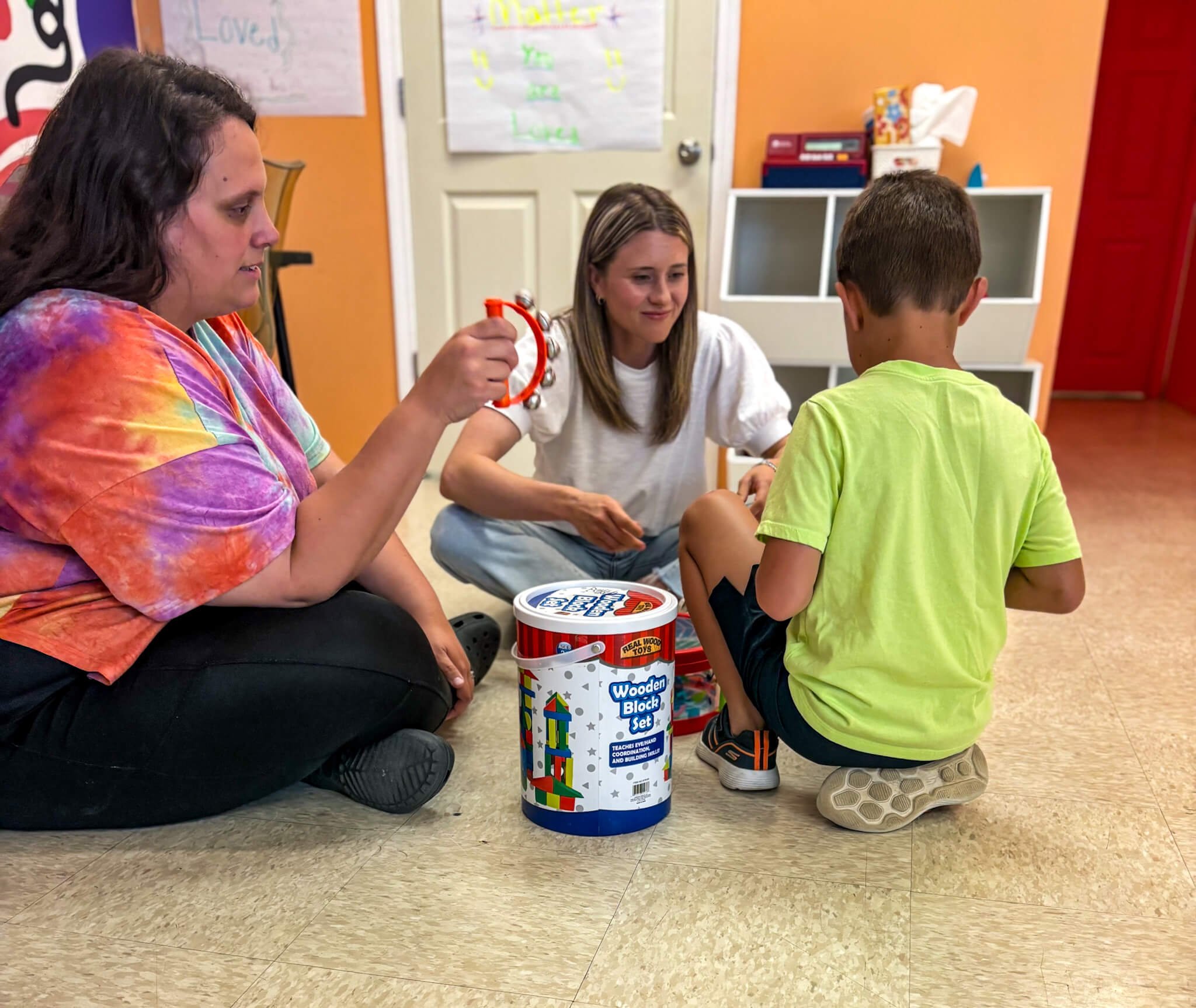 Therapists working one-on-one with a child at the clinic